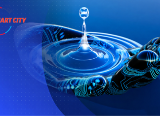 AI in Water Infrastructure: Bangalore’s Water Management Transformation Digital artwork depicting a glowing robotic hand beneath a water drop creating ripples, with circuit board patterns in blue and a "Smart City" logo on the left.