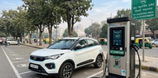 Delhi Passes Its Charging Target Three Months Early Public electric vehicle charging station with a white EV parked and charging in Delhi