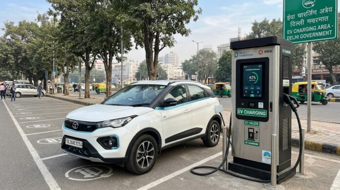 EV Charging Station Delhi Street Parking Public electric vehicle charging station with a white EV parked and charging in Delhi