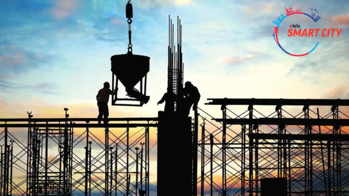 Silhouetted construction site at sunset representing India's growing infrastructure project development