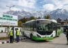 SSCL CEO Reviews Smart City Projects, Directs Timely Completion and Better Maintenance electric bus charging at batamaloo station in srinagar with snow-capped mountains in the background