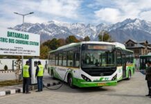 SSCL CEO Reviews Smart City Projects, Directs Timely Completion and Better Maintenance electric bus charging at batamaloo station in srinagar with snow-capped mountains in the background