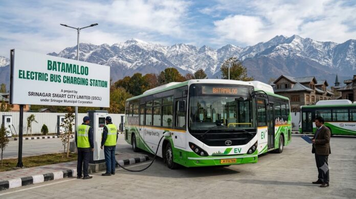 electric bus charging at batamaloo station in srinagar with snow-capped mountains in the background